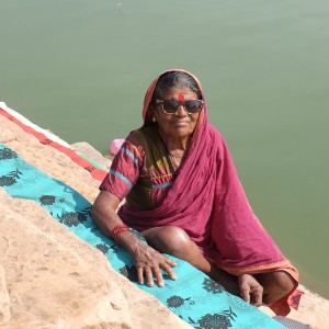 Lady washing clothing India